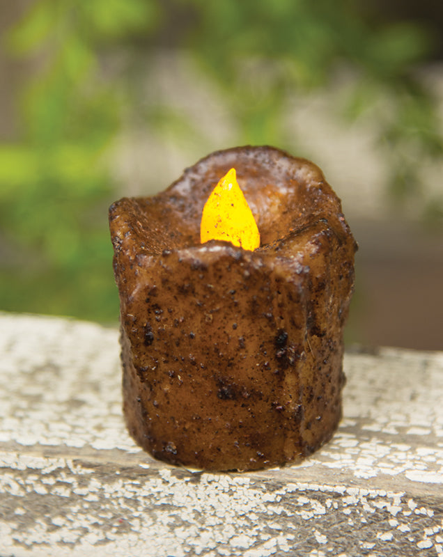 Burnt mustard mini dripped timer votive on wood surface