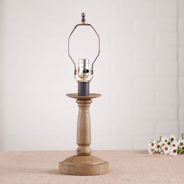 Butcher's Lamp Base in Americana Pearwood with white background and daisies beside it.