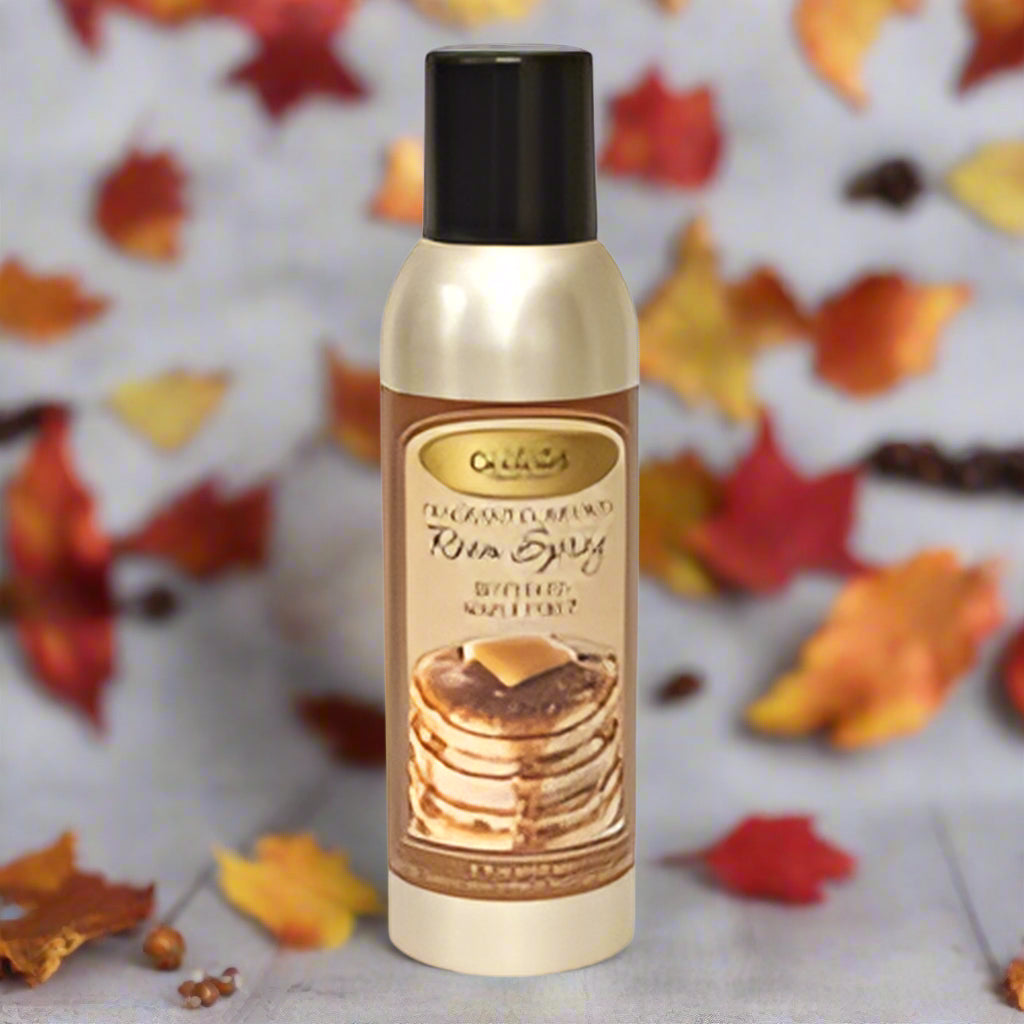 A bottle of Buttered Maple Syrup room spray by CW Industries, Inc. with a label showing a stack of pancakes with syrup on top.