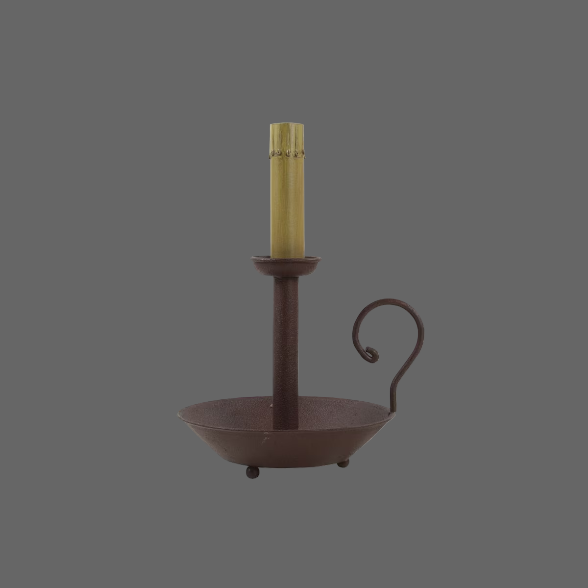 A red chamberstick lamp with a single candle holder on a round base, having a sleek and traditional design.