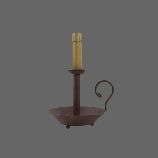 A red chamberstick lamp with a single candle holder on a round base, having a sleek and traditional design.