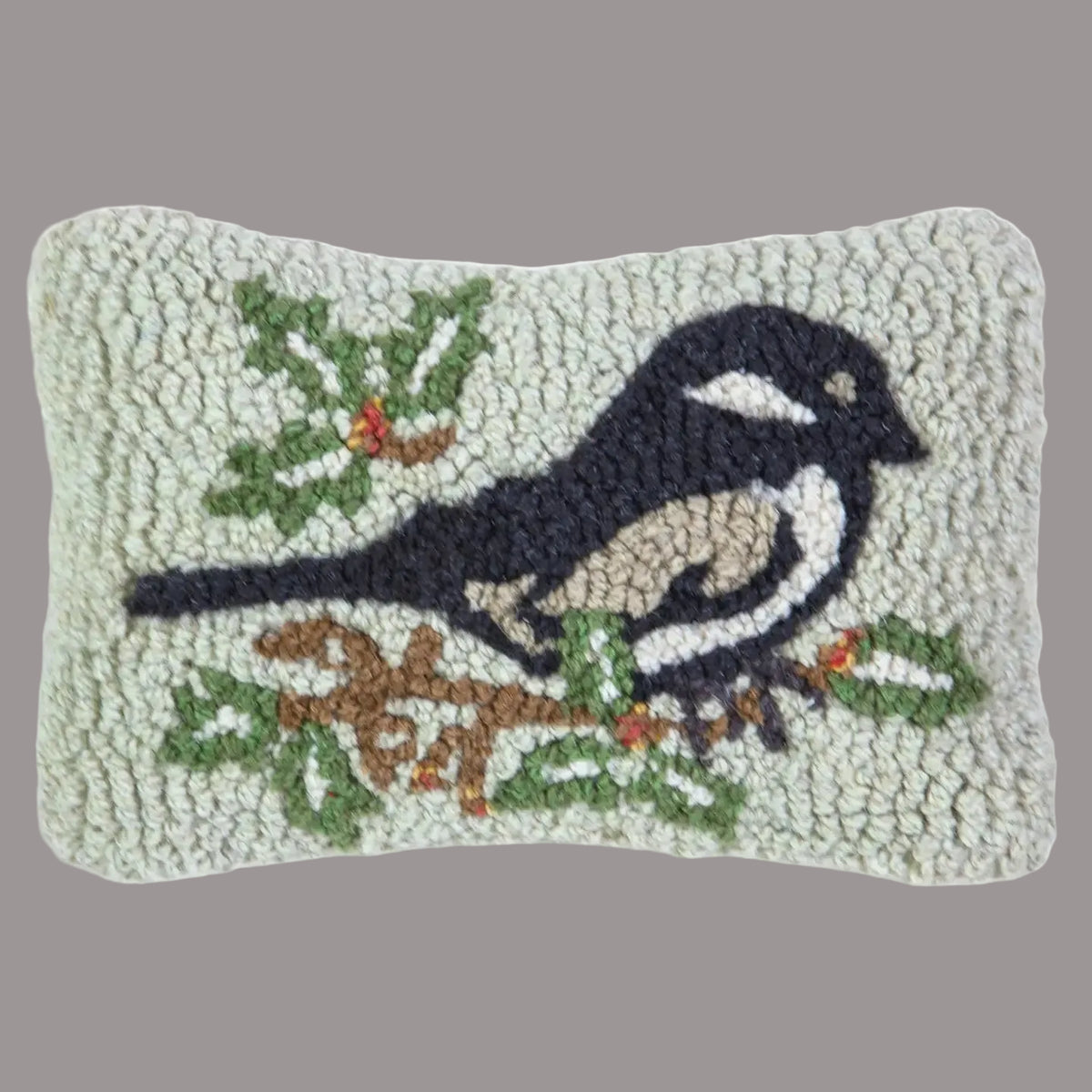 Decorative pillow with a bird design on a white background