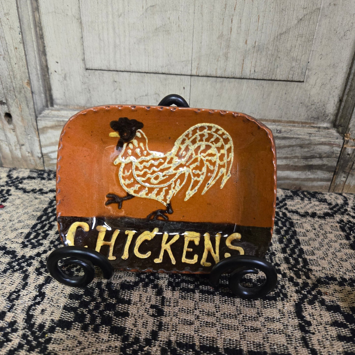 Small rectangular redware plate with animal motif and the word 'CHICKENS'