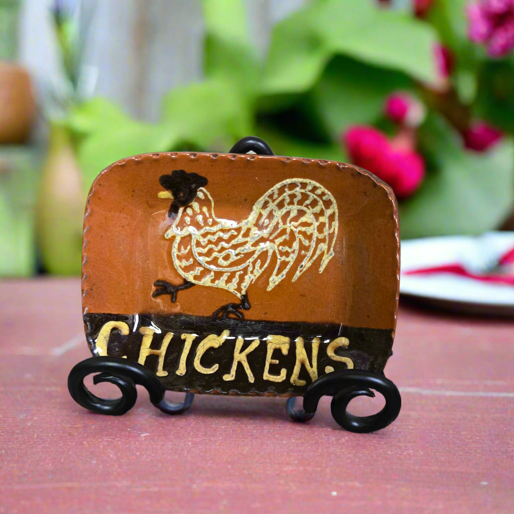 Small rectangular redware plate with animal motif and the word 'CHICKENS'
