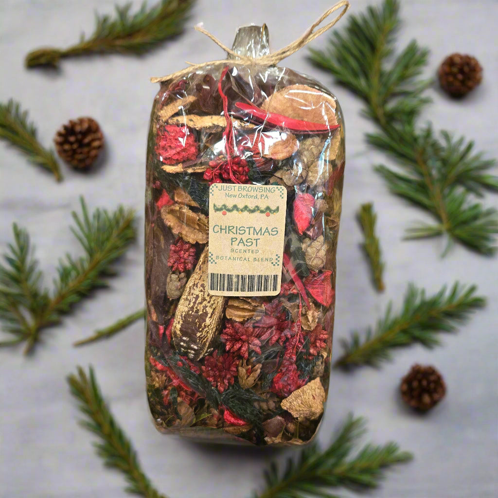 Bag of Christmas pastries with a label on a green leafy background