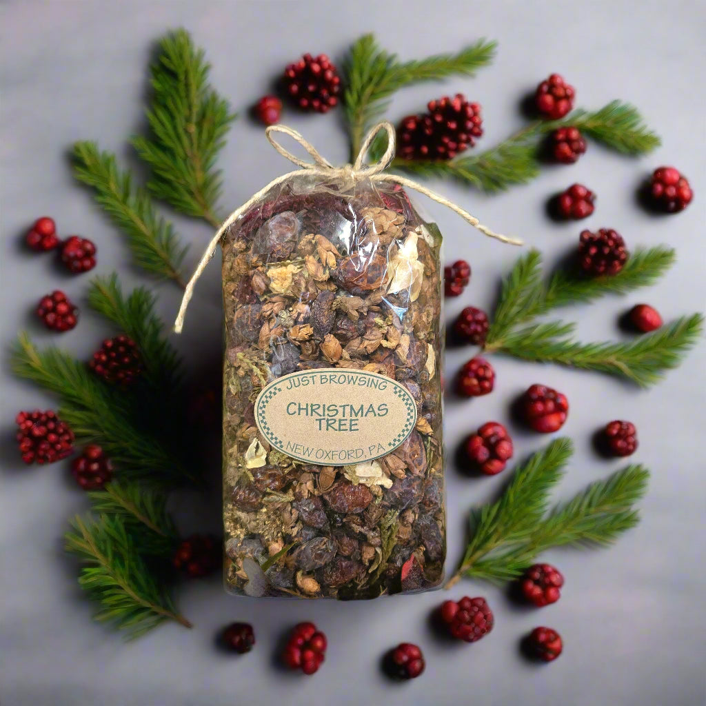 Pouch labeled 'Christmas Tree' on a bed of artificial greenery