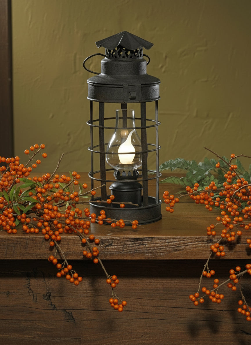 Black accent light with globe displayed with Christmas decorations