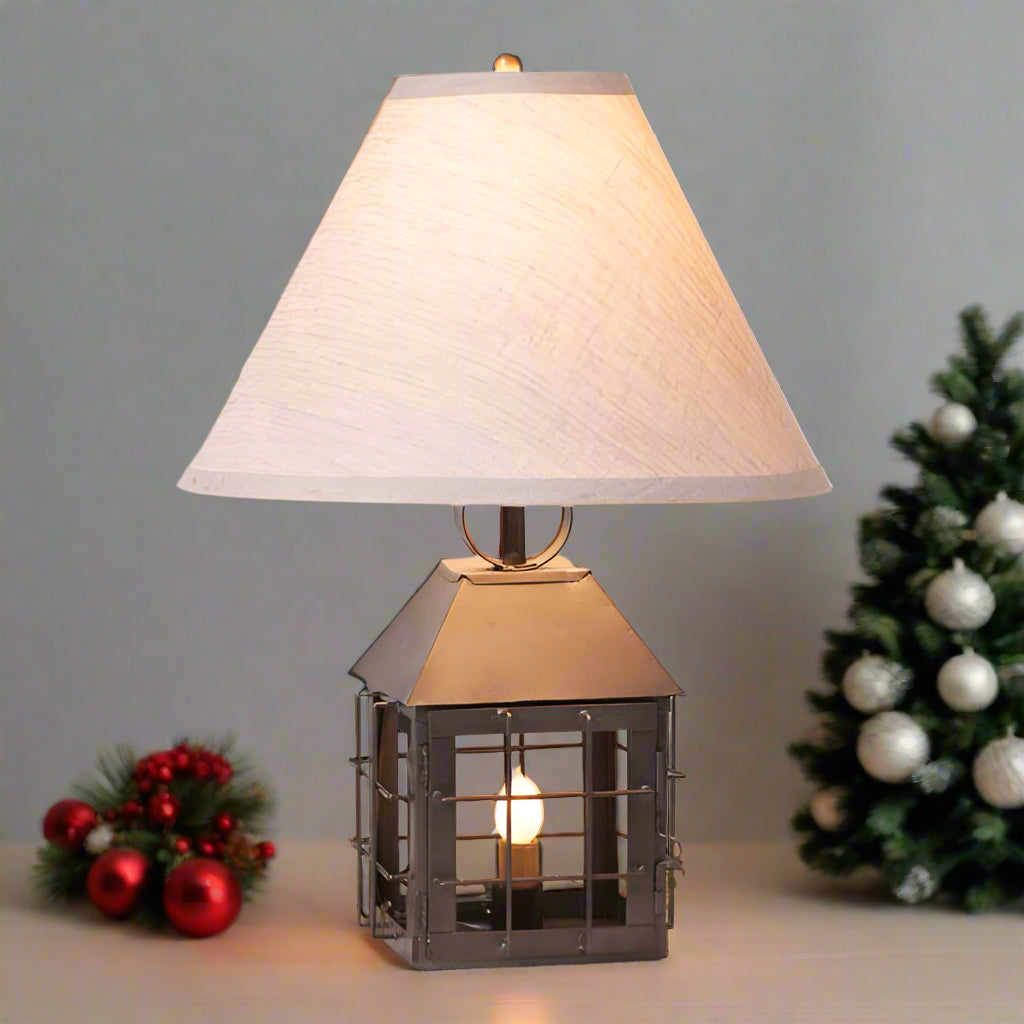 Table lamp with a lantern base on a white surface