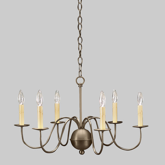 Bronze chandelier with six candle-style lights on a gray background