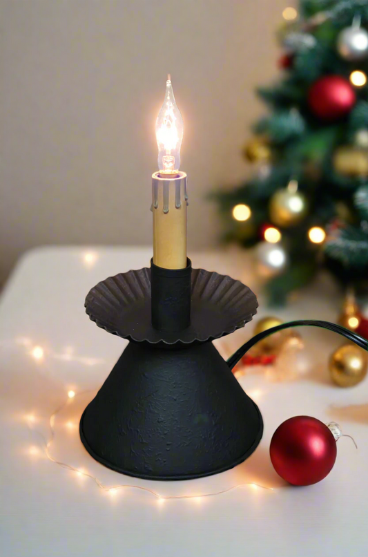 A Cone Accent Light with a textured black finish, featuring a bulb at the top, a scalloped edge design around the base, and a 7-foot cord with a line switch.