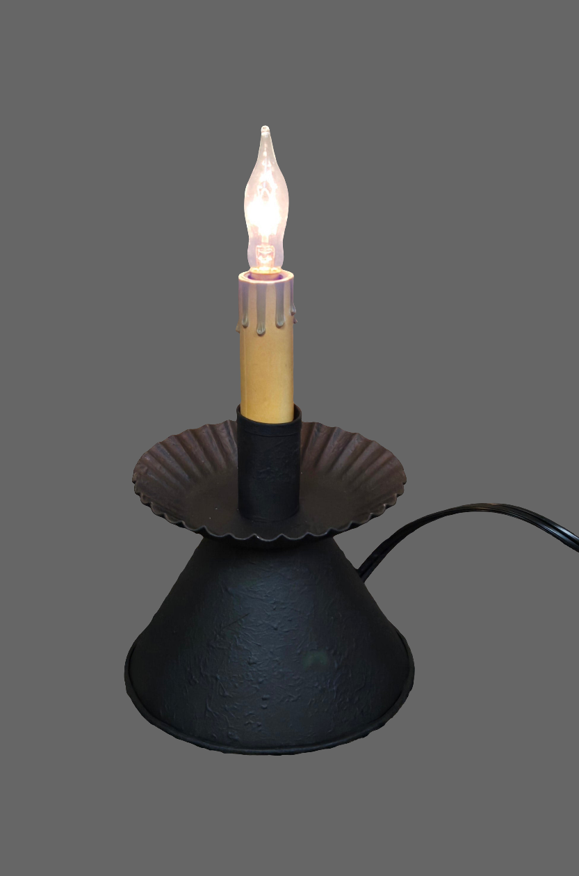 A Cone Accent Light with a textured black finish, featuring a bulb at the top, a scalloped edge design around the base, and a 7-foot cord with a line switch.