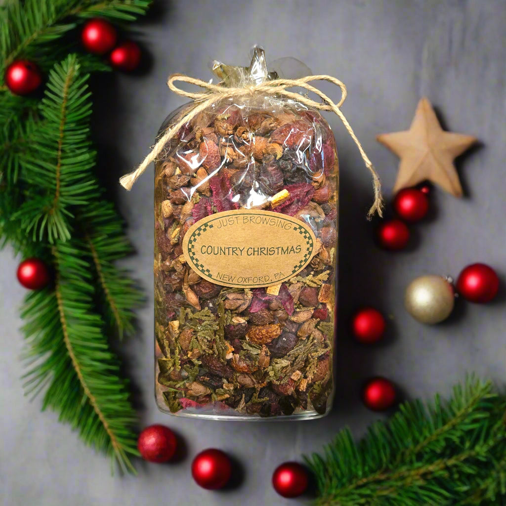 Bag of 'Country Christmas' potpourri with festive decorations on a gray background