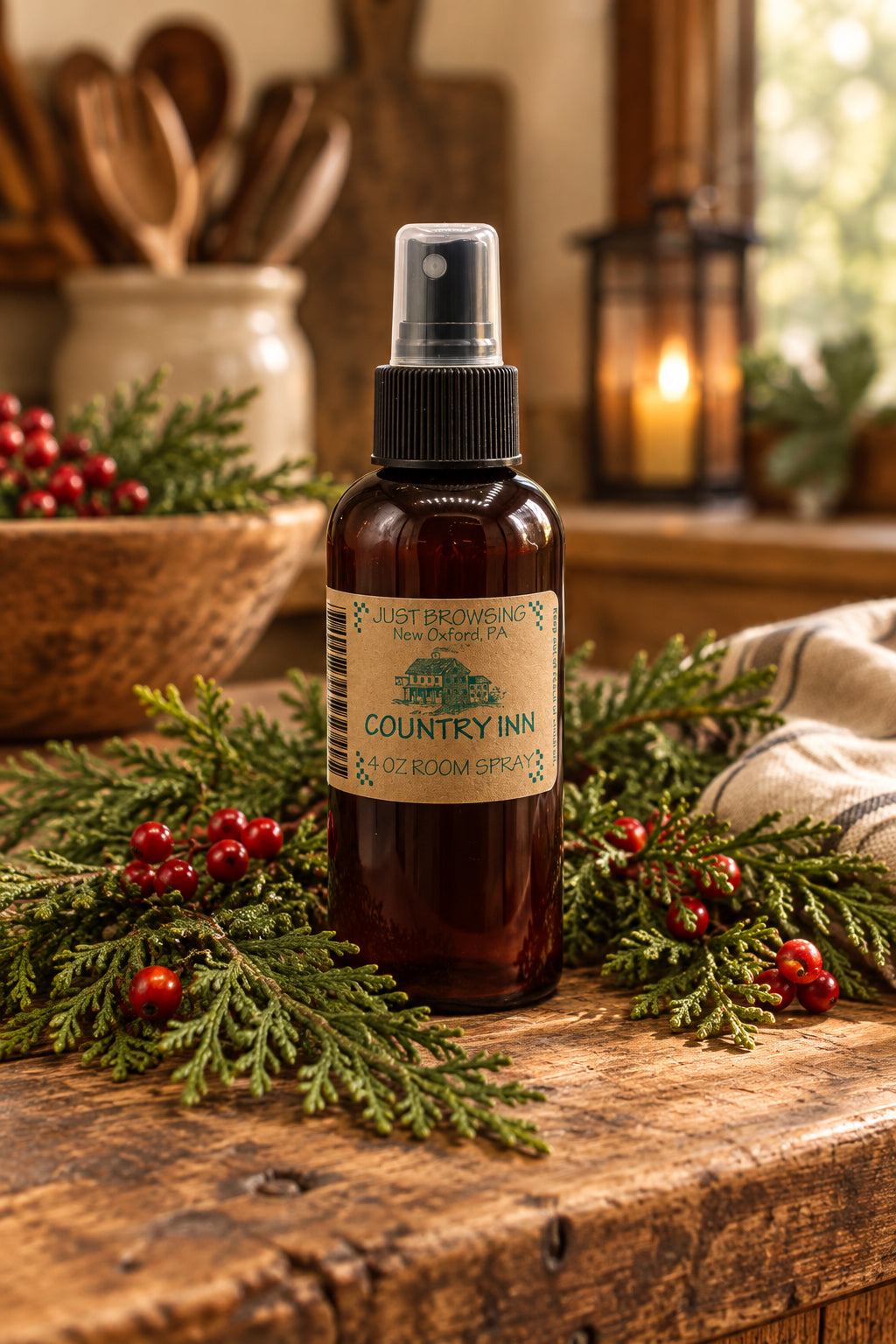 A 4oz bottle of Country Inn room spray with a mist spray top, labeled as such and with a brown liquid visible.