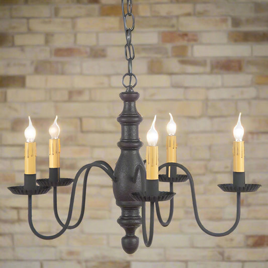 Primitive wooden five arm chandelier with 5 candelabra sockets in a black paint finish on white background.