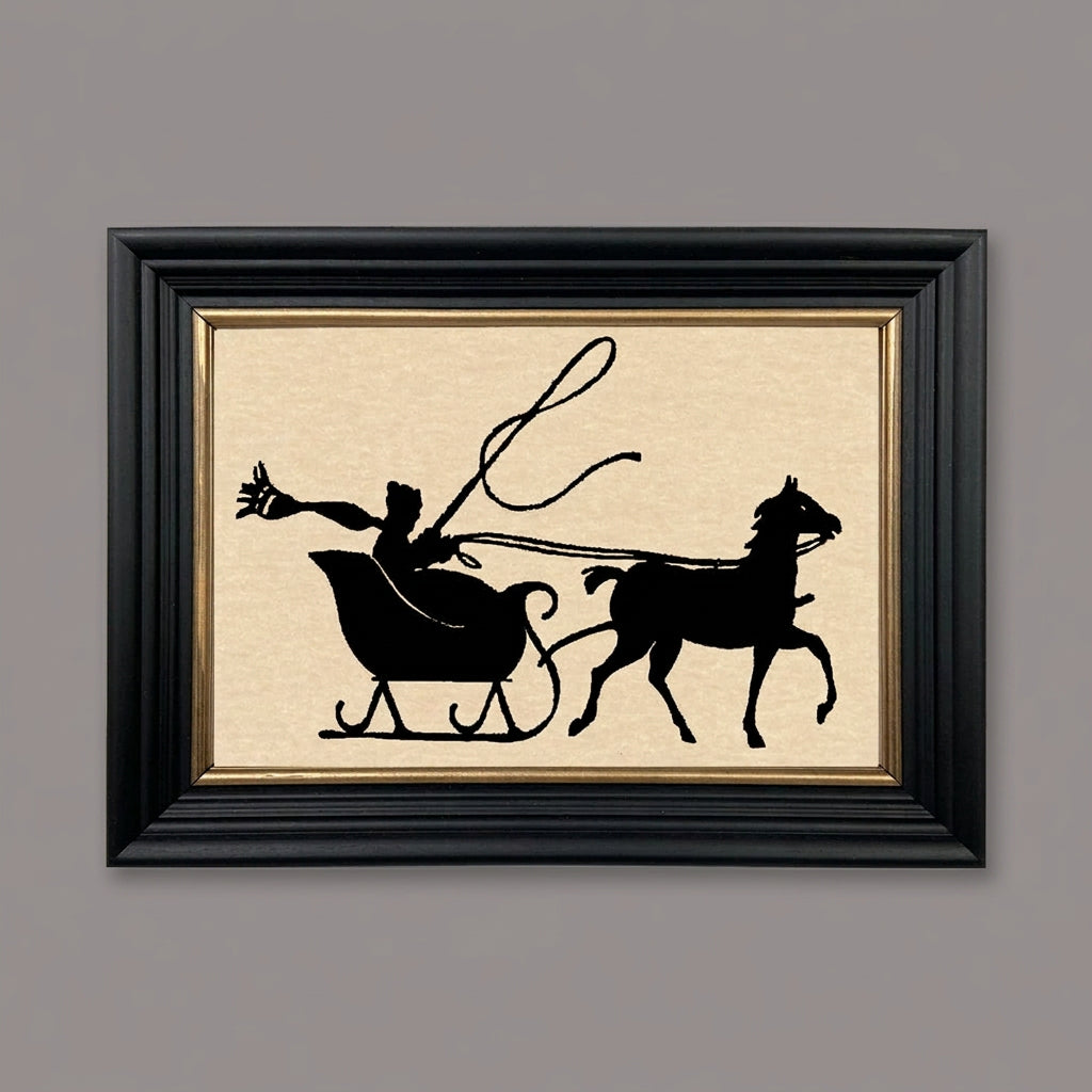 Framed paper cut silhouette artwork featuring a whip and reindeer, primarily in black, gold, and white colors, enclosed in a solid ash wood frame with gold trim.