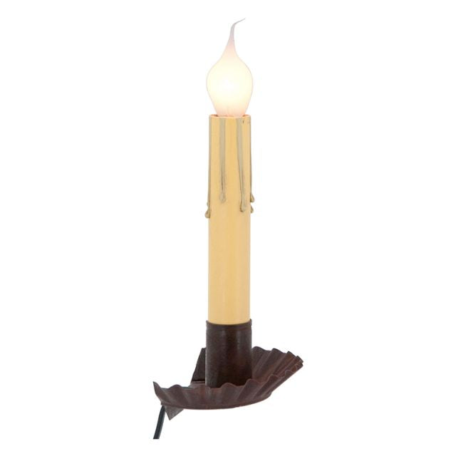 A rustic tin window sill light with a visible wax candle top and a brown base, designed to be placed on a window sill.