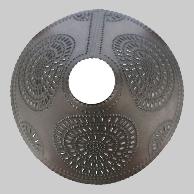 Decorative round pillow with intricate patterns on a white background