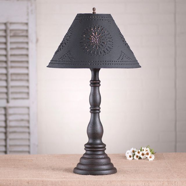 Decorative table lamp with a dark gray shade on a neutral background