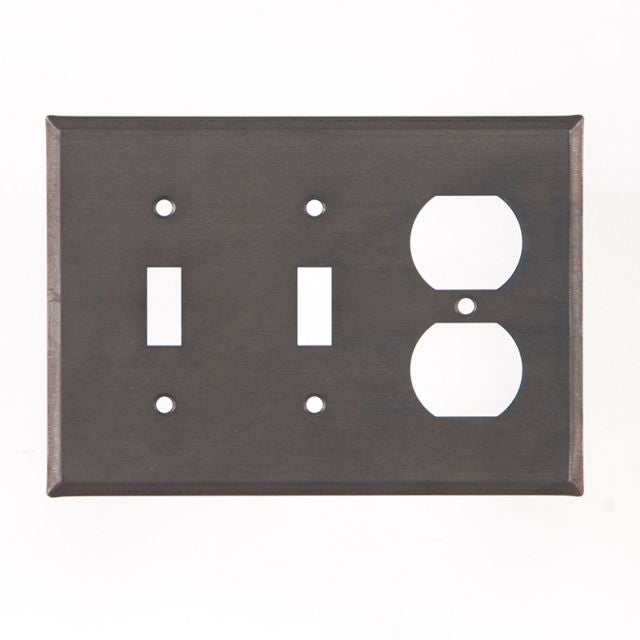 A double switch and outlet cover with a matte black finish and a rustic design, featuring two switch cutouts and two outlet covers on a rectangular tin plate.
