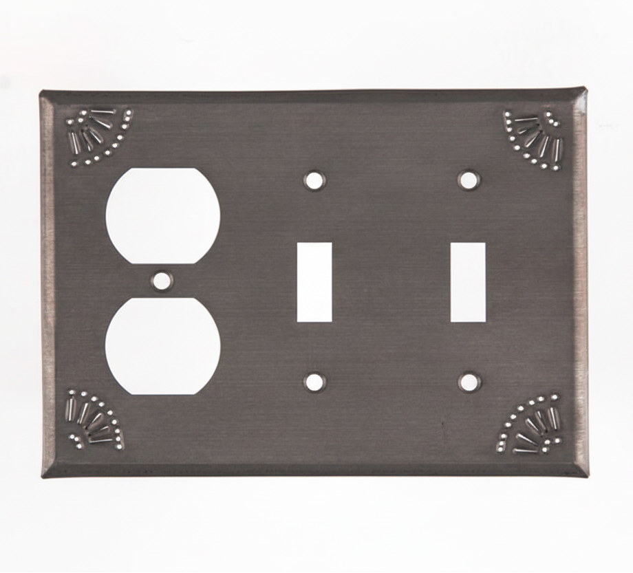 Decorative wall plate with three outlets on a white background