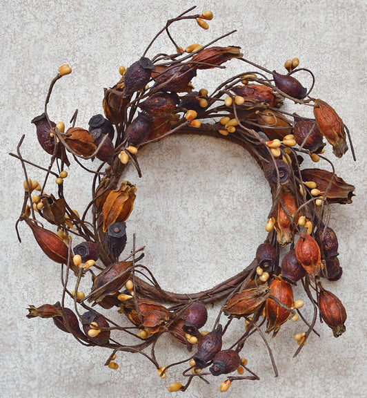 Decorative wreath with autumnal elements on a neutral background