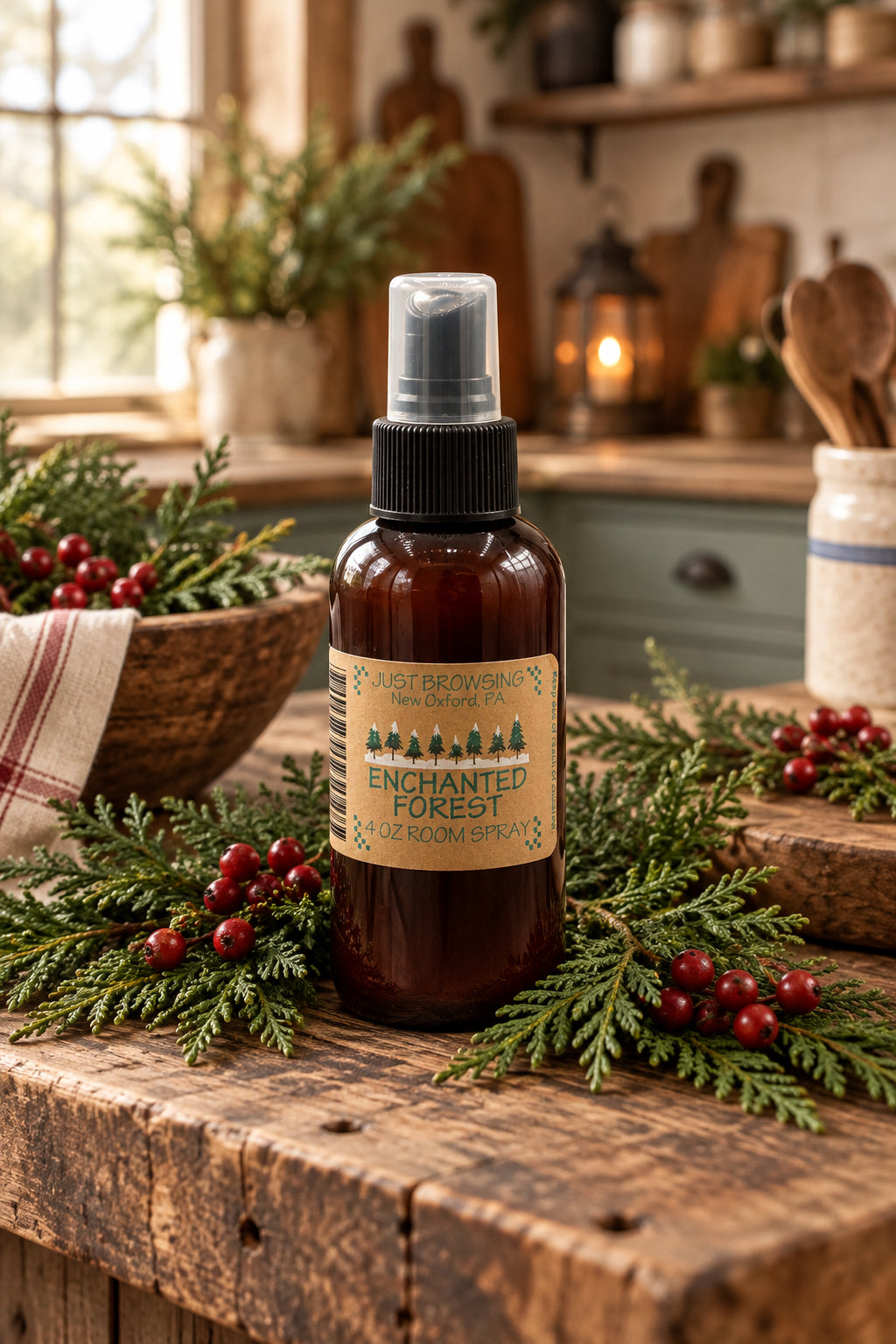 A 4oz bottle of Enchanted Forest room spray with a mist spray top. The bottle is brown with a label that has green text and a Christmas tree graphic, indicating a holiday-themed fragrance.