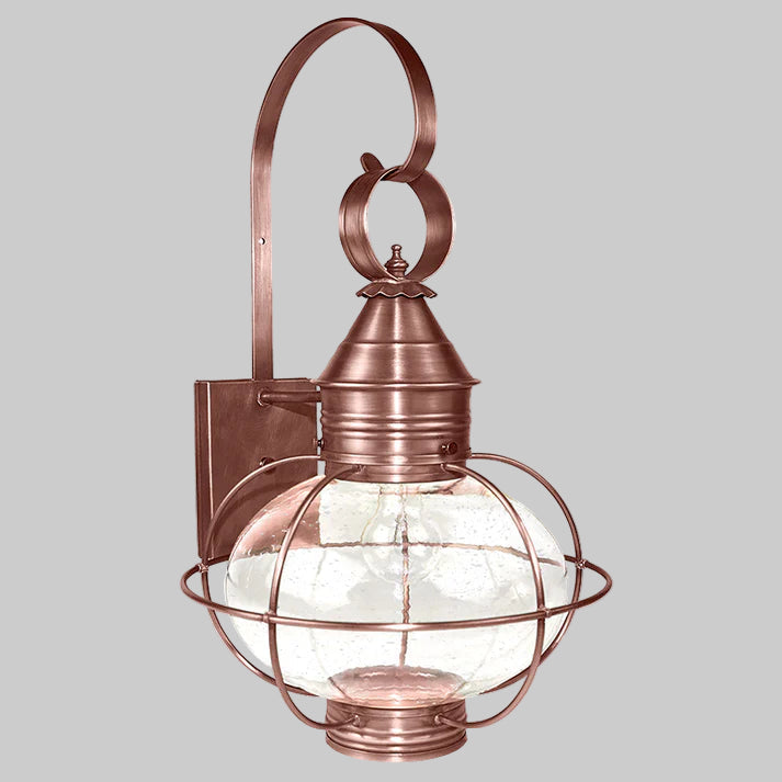 Copper outdoor wall light fixture with glass shade on a white background