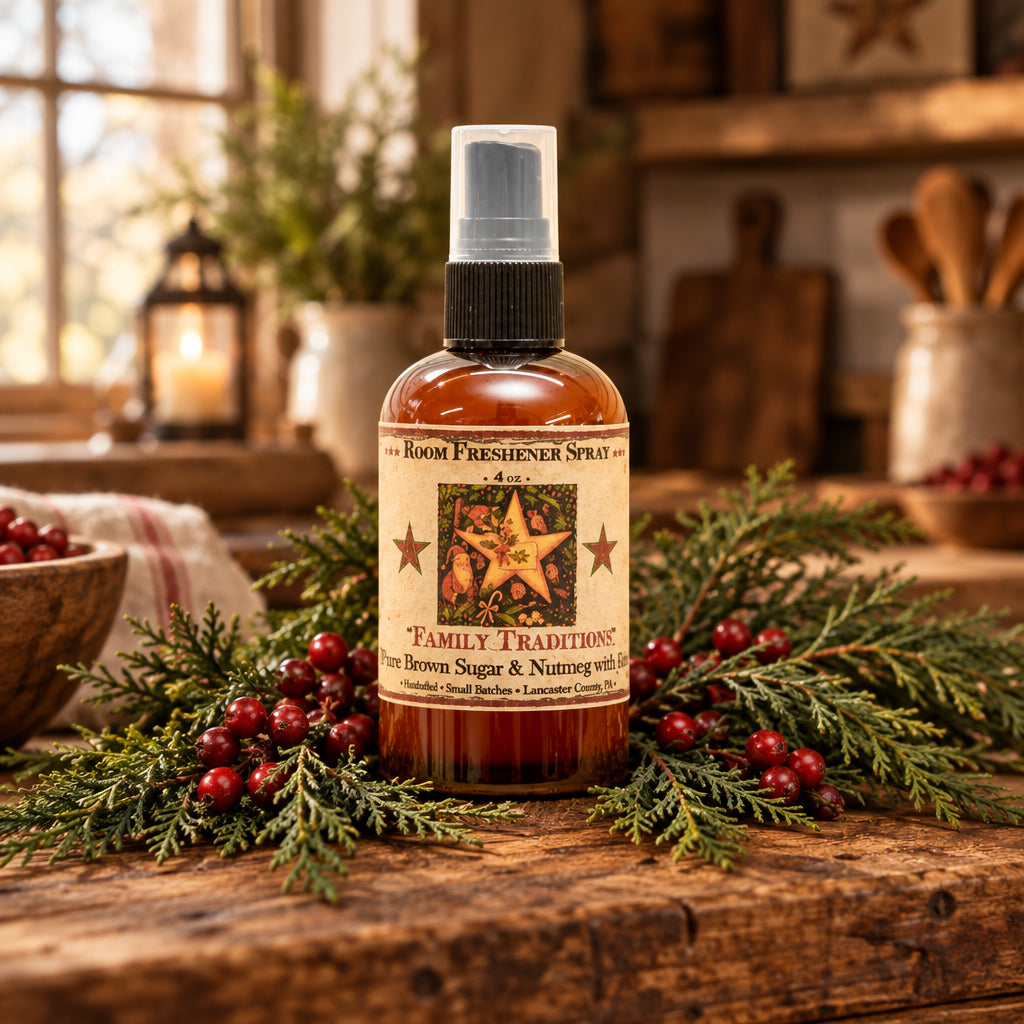 Room freshener spray bottle with a festive label against a blurred Christmas tree background