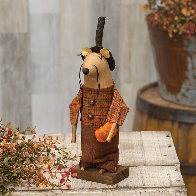 Farmer plaid mouse with black hat holding a pumpkin on a wooden base