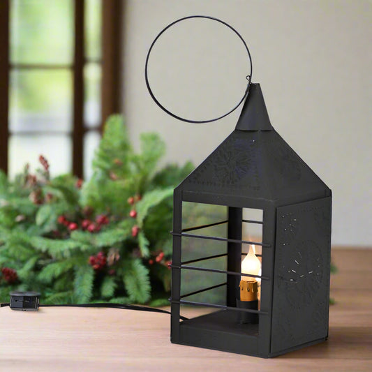 Black decorative lantern with a light bulb inside on a white background
