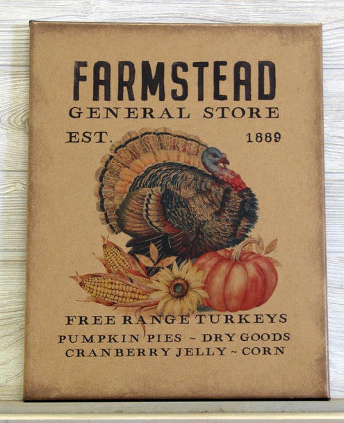 A square decorative sign or print for 'Farmstead General Store' with a vintage turkey, pumpkins, corn, and sunflower illustration on a tan background, photographed against a light wood surface.