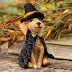 Felted witch dog wearing black hat and coat