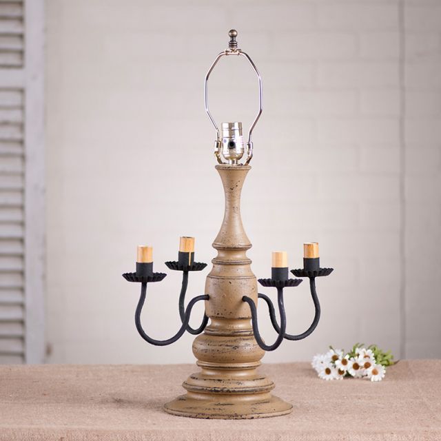 Wooden table lamp with four sockets with pearwood paint finish on white background