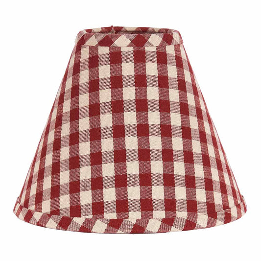 A barn red and white checkered lampshade with a regular clip base.