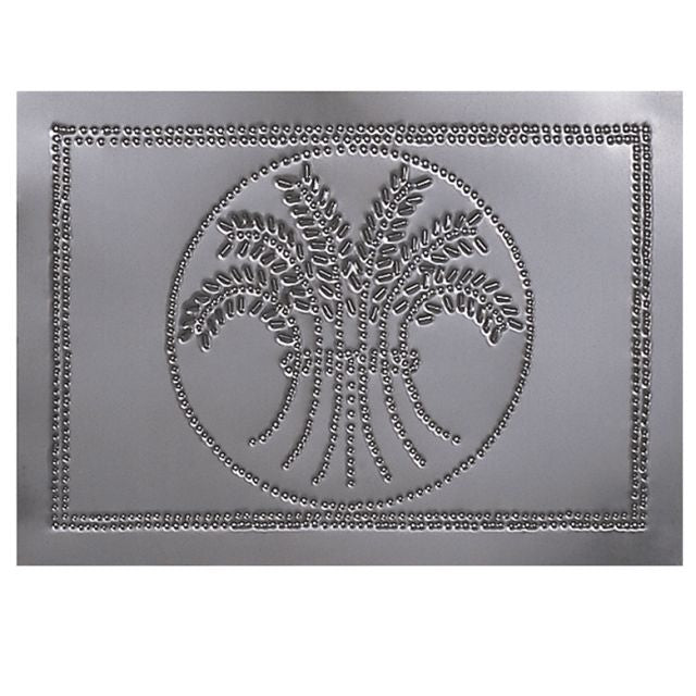 A circular metal panel with a pierced wheat design and a country tin finish.