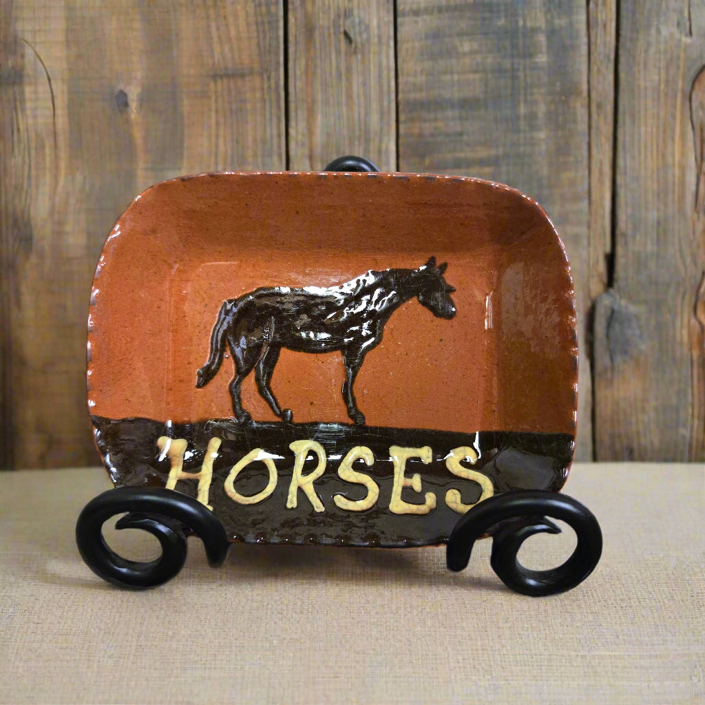 Small rectangular redware plate with an animal motif and the word 'HORSES'