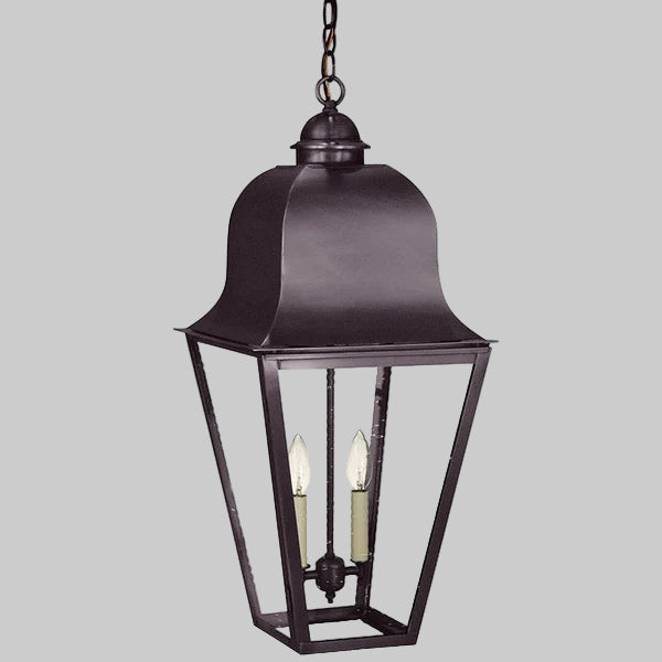 Dark metal hanging lantern with two candle-like lights on a gray background