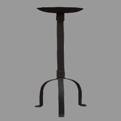 A black iron pillar holder with three legs and a round candle dish at the top