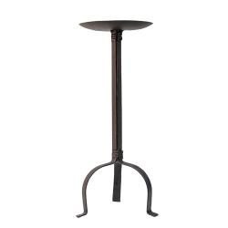 A black iron pillar holder with three legs and a round candle dish at the top