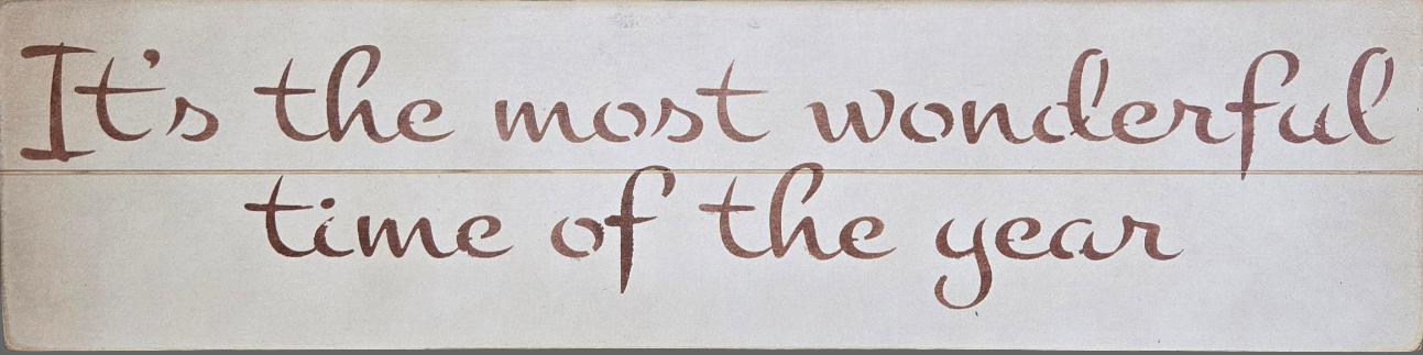 Wooden sign with 'It's the most wonderful time of the year' text on a cream background