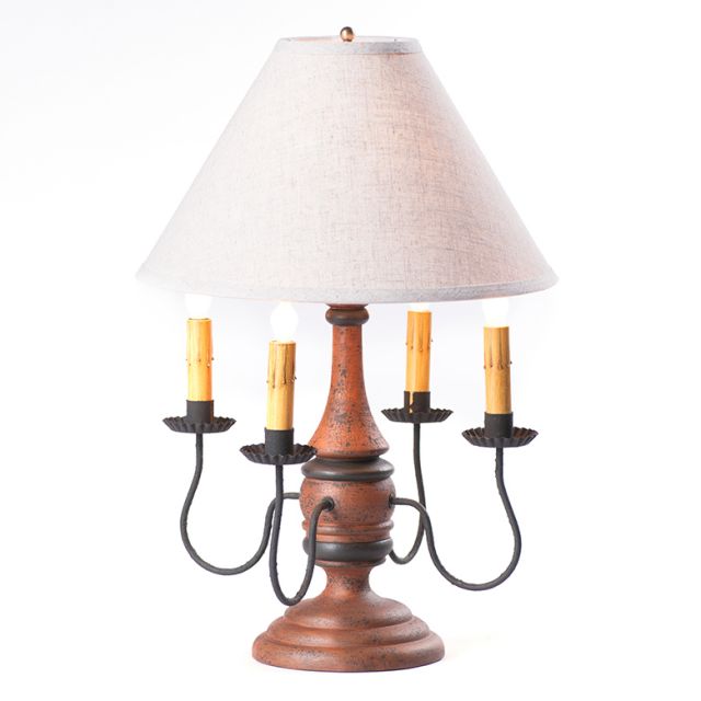 Decorative table lamp with wooden base and white shade on a white background