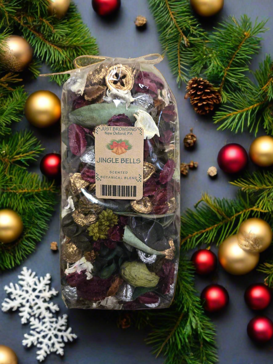 Bag of 'Jingle Bells' botanical blend with a label on a gray background