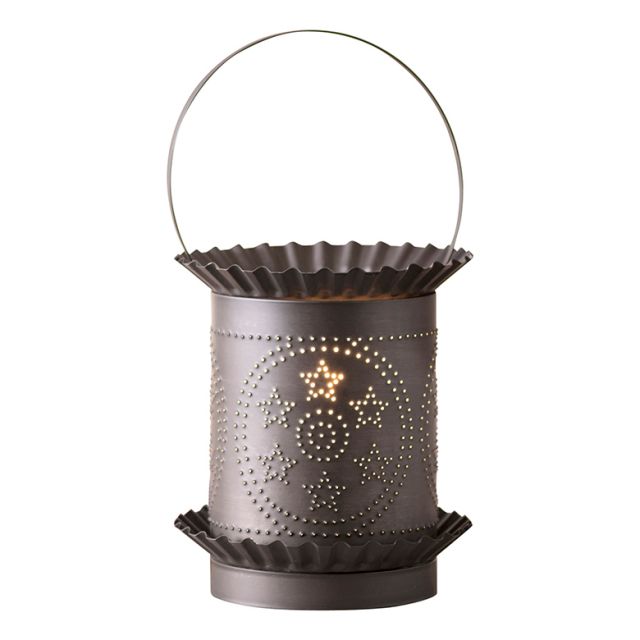 Punched tin tart warmer on a white background