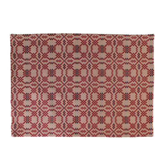 A rectangular Kendall Jacquard Red Placemat with an intricate geometric pattern.