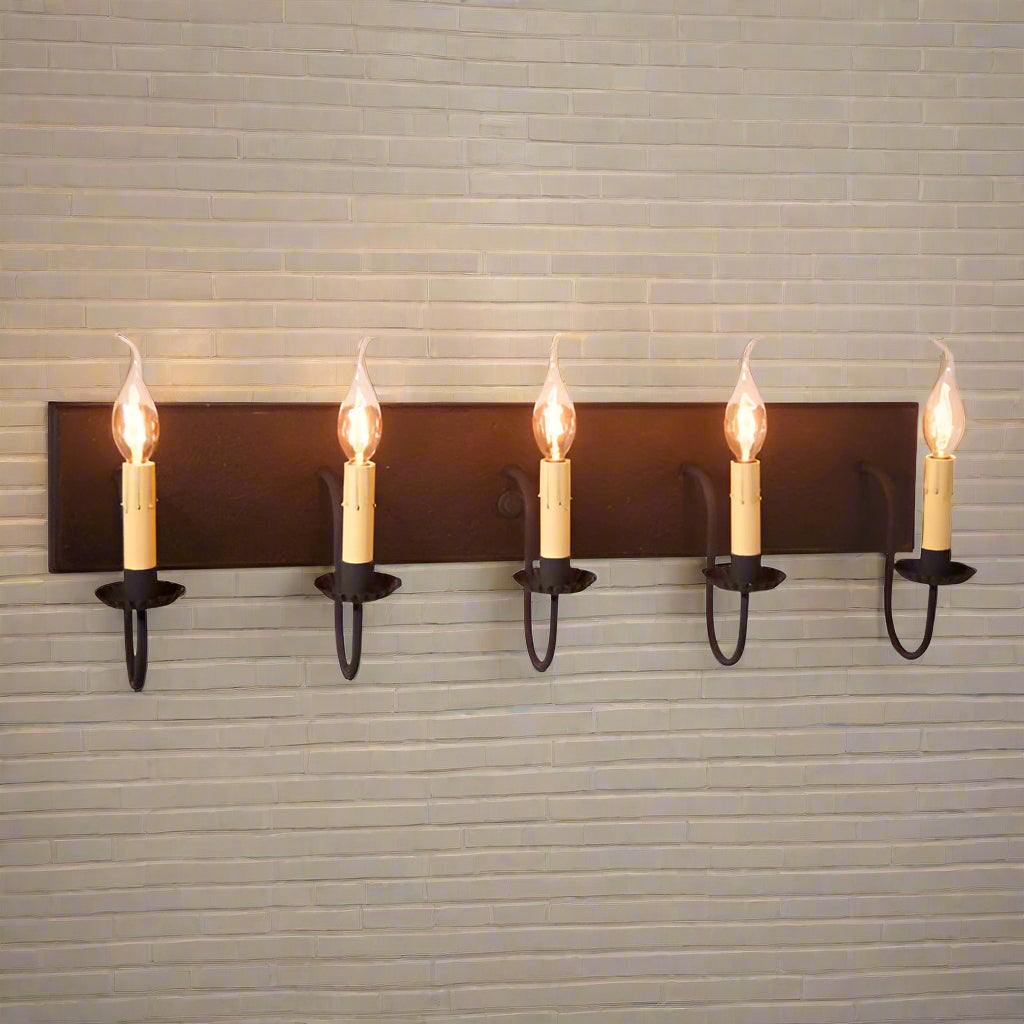 A black five-light vanity light fixture with textured arms and a red painted body, featuring E12/Candelabra sockets.