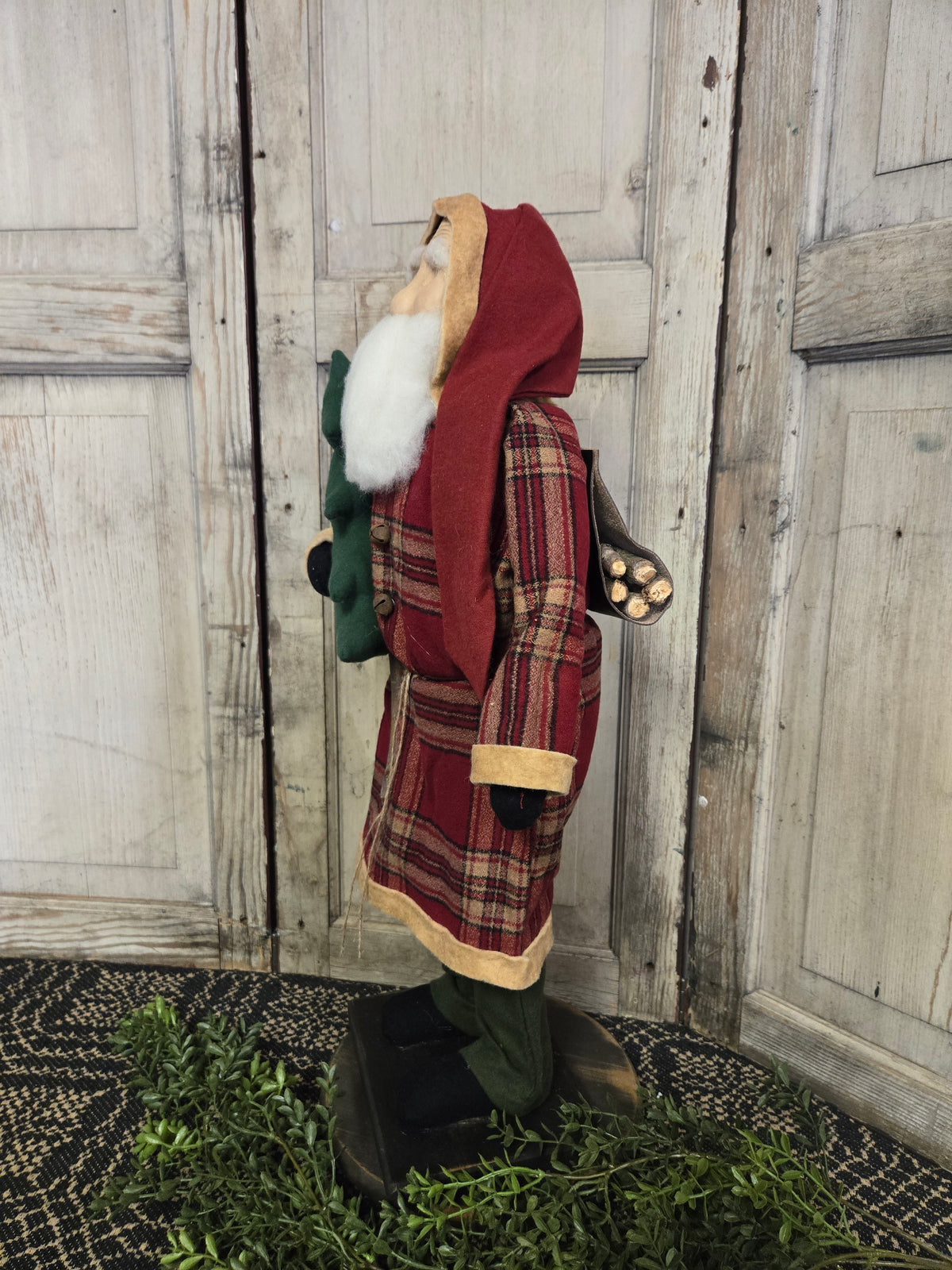 Side view of Santa with weathered wood background.