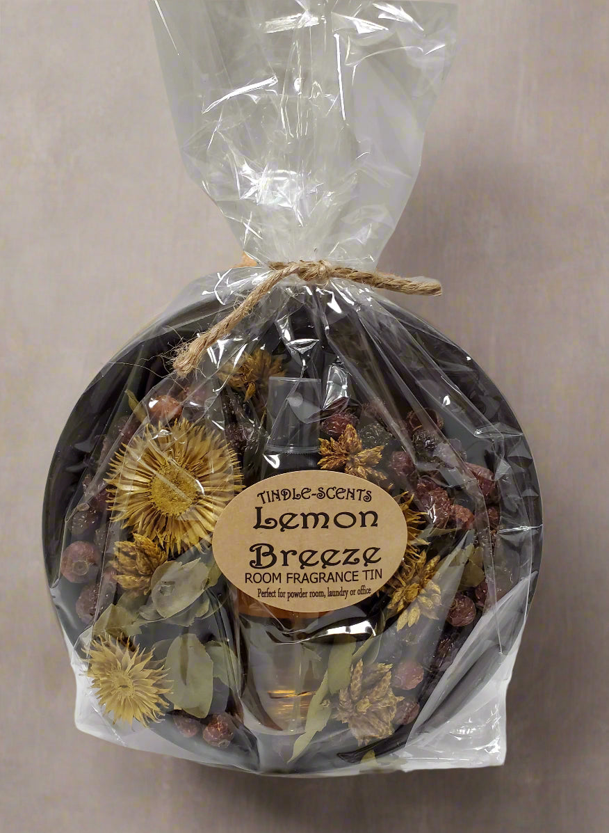 Metal pan with potpourri and scented oil in packaging labeled "Lemon Breeze"