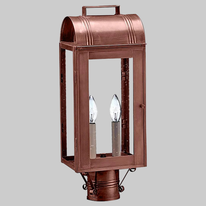 Copper outdoor lantern with two light bulbs on a gray background