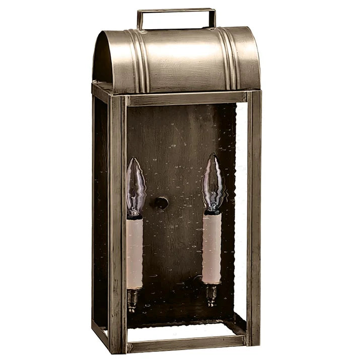 Decorative metal lantern with two candle-like lights on a gray background