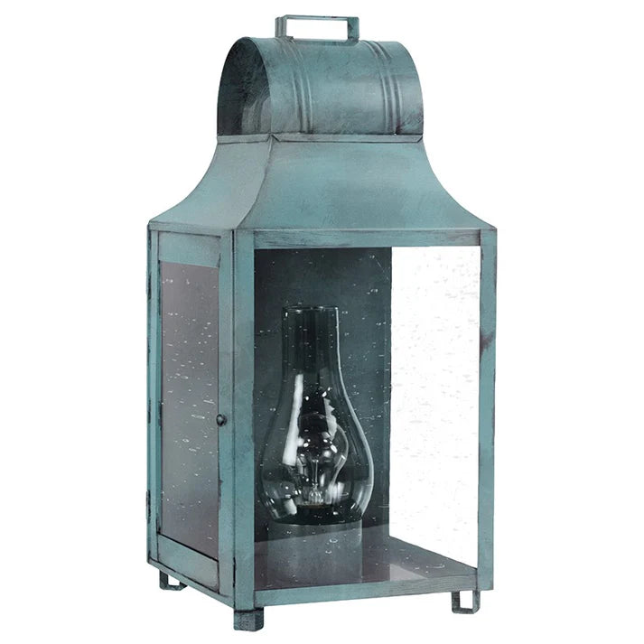 Vintage-style teal lantern with glass cover on a white background